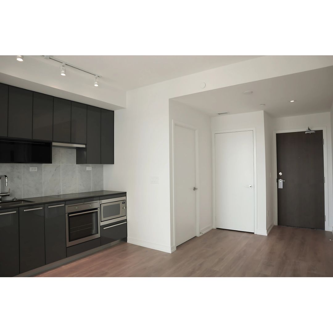 Modern condo interior with kitchen and entry