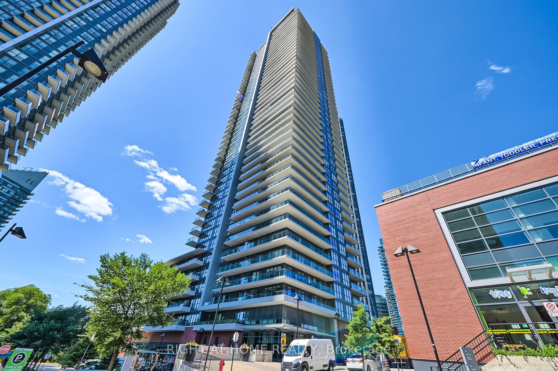 Modern condominium towers against a blue sky