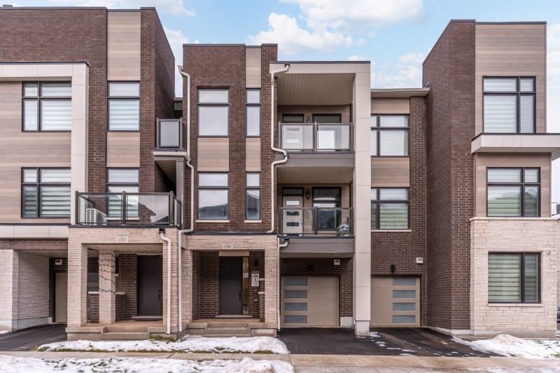 Modern townhouse exterior in a residential row
