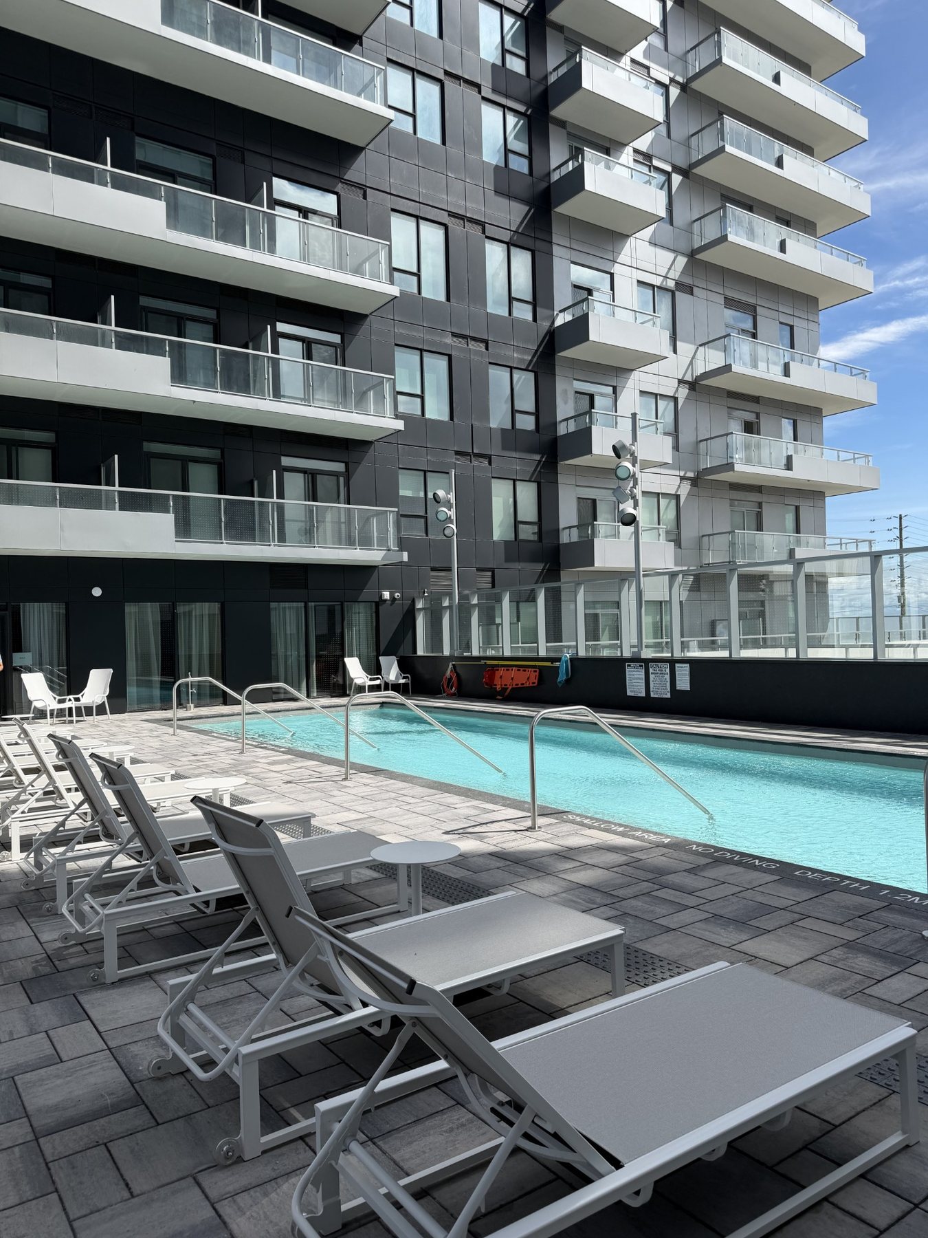 Rooftop pool deck with loungers